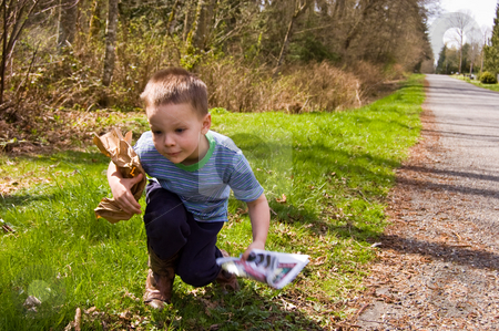 To use this stock image in your creative project, please select the size you need over to the right and click the "Add to Cart" button.
Your downloaded image will come with the Cutcaster watermark removed so don’t worry about the watermark you see on this page. Young Boy Picking Up Garbage - Ecology stock photo, A young 4 year old Caucasian boy is picking up garbage on the side of the road to do his share for helping ecology and environmental issues. by Valerie Garner
