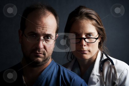 To use this stock image in your creative project, please select the size you need over to the right and click the "Add to Cart" button.
Your downloaded image will come with the Cutcaster watermark removed so don’t worry about the watermark you see on this page. Health Care Professionals stock photo, Portrait of male and female health care professionals by Scott Griessel