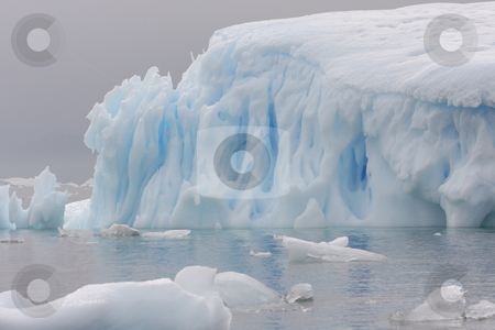To use this stock image in your creative project, please select the size you need over to the right and click the "Add to Cart" button.
Your downloaded image will come with the Cutcaster watermark removed so don’t worry about the watermark you see on this page. Iceberg in Antarctica stock photo, by Chris Budd