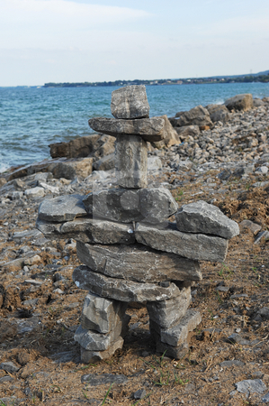 To use this stock image in your creative project, please select the size you need over to the right and click the "Add to Cart" button.
Your downloaded image will come with the Cutcaster watermark removed so don’t worry about the watermark you see on this page. Lake shore with rock sculptor. stock photo, Lake Ontario shore with big rocks and waves splashing on the rocks. by Horst Petzold