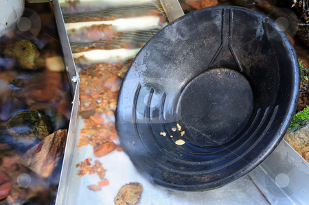 To use this stock image in your creative project, please select the size you need over to the right and click the "Add to Cart" button.
Your downloaded image will come with the Cutcaster watermark removed so don’t worry about the watermark you see on this page. Gold Pan And Nuggets stock photo, Black plastic gold pan with 6 gold nuggets inside a sluice box with some water flowing through it. by Lynn Bendickson