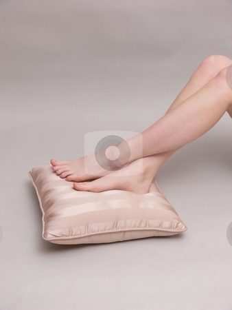 To use this stock image in your creative project, please select the size you need over to the right and click the "Add to Cart" button.
Your downloaded image will come with the Cutcaster watermark removed so don’t worry about the watermark you see on this page. Bare feet stock photo, Young girl rest her bare feet on a pillow on the floor. by Horst Petzold