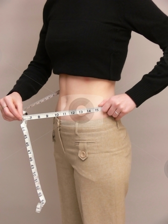 To use this stock image in your creative project, please select the size you need over to the right and click the "Add to Cart" button.
Your downloaded image will come with the Cutcaster watermark removed so don’t worry about the watermark you see on this page. Girl measuring stock photo, A young girl is measuring her waist for weight lose. by Horst Petzold
