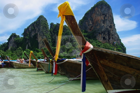 To use this stock image in your creative project, please select the size you need over to the right and click the "Add to Cart" button.
Your downloaded image will come with the Cutcaster watermark removed so don’t worry about the watermark you see on this page. Boats on a beach stock photo, Boats on a tropical beach. West Railay, Krabi Province, Thailand by Martin Darley
