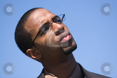 To use this stock image in your creative project, please select the size you need over to the right and click the "Add to Cart" button.
Your downloaded image will come with the Cutcaster watermark removed so don’t worry about the watermark you see on this page. Business Man Thinking stock photo, African American man wearing glasses and a business suit isolated over a blue background. by Todd Arena