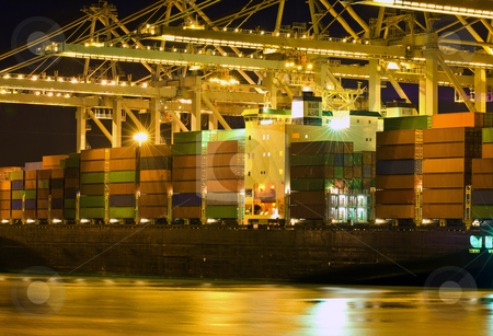 To use this stock image in your creative project, please select the size you need over to the right and click the "Add to Cart" button.
Your downloaded image will come with the Cutcaster watermark removed so don’t worry about the watermark you see on this page. Unloading of a bulk carrier stock photo, Close up of a container ship being unloaded by Corepics VOF