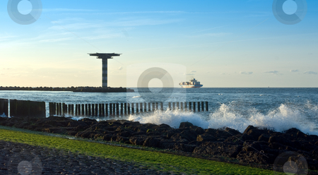 To use this stock image in your creative project, please select the size you need over to the right and click the "Add to Cart" button.
Your downloaded image will come with the Cutcaster watermark removed so don’t worry about the watermark you see on this page. Leaving port stock photo, A container ship leaving port on a tranquil evening, sailing past a helicopter platform by Corepics VOF