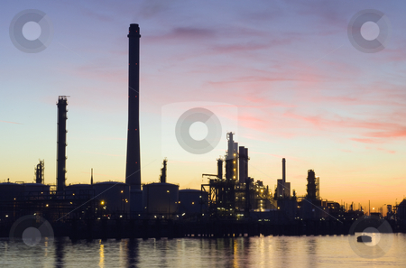 To use this stock image in your creative project, please select the size you need over to the right and click the "Add to Cart" button.
Your downloaded image will come with the Cutcaster watermark removed so don’t worry about the watermark you see on this page. Oil Refinery at sunset stock photo, The silhouette of an oil refinery at sunset, against a radiant sky by Corepics VOF