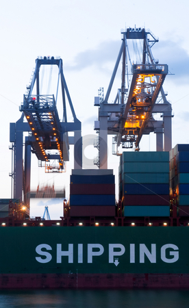 To use this stock image in your creative project, please select the size you need over to the right and click the "Add to Cart" button.
Your downloaded image will come with the Cutcaster watermark removed so don’t worry about the watermark you see on this page. Loading of a sea-going cargo ship stock photo, The continuous loading with two huge cranes of a sea going cargo ship during twilight hour. by Corepics VOF