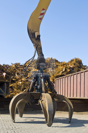 To use this stock image in your creative project, please select the size you need over to the right and click the "Add to Cart" button.
Your downloaded image will come with the Cutcaster watermark removed so don’t worry about the watermark you see on this page. Scrap heap claw stock photo, A claw, attatched to a huge crane in front of a scrap heap by Corepics VOF