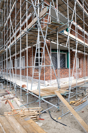 To use this stock image in your creative project, please select the size you need over to the right and click the "Add to Cart" button.
Your downloaded image will come with the Cutcaster watermark removed so don’t worry about the watermark you see on this page. Scaffolding stock photo, Scaffolding around a building under construction at a construction site in Amsterdam, the Netherlands by Corepics VOF