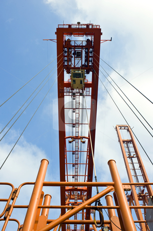 To use this stock image in your creative project, please select the size you need over to the right and click the "Add to Cart" button.
Your downloaded image will come with the Cutcaster watermark removed so don’t worry about the watermark you see on this page. Container hoisting rig stock photo, The hoisting rig, used to haul containers at an industrial harbor, with the wires leading up to a huge crane by Corepics VOF