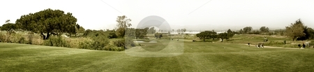 To use this stock image in your creative project, please select the size you need over to the right and click the "Add to Cart" button.
Your downloaded image will come with the Cutcaster watermark removed so don’t worry about the watermark you see on this page. Golf stock photo, Panoramic shot of a golf fairway near Ventura by Henrik Lehnerer