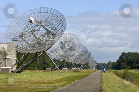 To use this stock image in your creative project, please select the size you need over to the right and click the "Add to Cart" button.
Your downloaded image will come with the Cutcaster watermark removed so don’t worry about the watermark you see on this page. Eleven Radio Telescopes in a row stock photo, The Eleven Radio Telescopes, located in Westerbork, the Netherlands, in a row, with a maintenance cart near the odd one out. by Corepics VOF