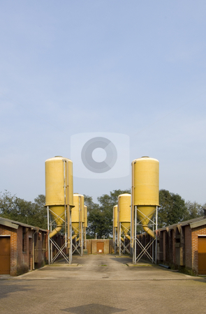 To use this stock image in your creative project, please select the size you need over to the right and click the "Add to Cart" button.
Your downloaded image will come with the Cutcaster watermark removed so don’t worry about the watermark you see on this page. Agricultural silos stock photo, Industrial silos on a pig farm by Corepics VOF