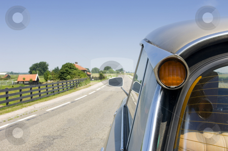 To use this stock image in your creative project, please select the size you need over to the right and click the "Add to Cart" button.
Your downloaded image will come with the Cutcaster watermark removed so don’t worry about the watermark you see on this page. A classic french car in a typical Dutch landscape stock photo, A vintage french car seen from behind in a quaint, archetypal Duch country lane by Corepics VOF