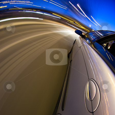 To use this stock image in your creative project, please select the size you need over to the right and click the "Add to Cart" button.
Your downloaded image will come with the Cutcaster watermark removed so don’t worry about the watermark you see on this page. Around the bend stock photo, A car driving at high speed through a curved section of the motorway by Corepics VOF