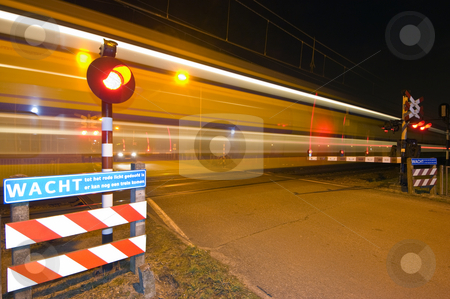 To use this stock image in your creative project, please select the size you need over to the right and click the "Add to Cart" button.
Your downloaded image will come with the Cutcaster watermark removed so don’t worry about the watermark you see on this page. Intercity stock photo, An intercity passing a railroad crossing at night by Corepics VOF