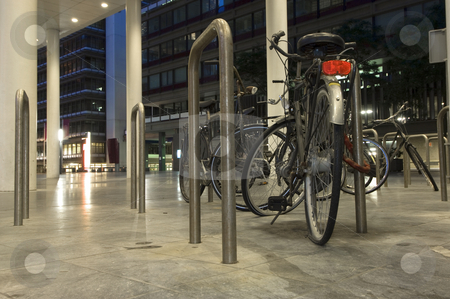 To use this stock image in your creative project, please select the size you need over to the right and click the "Add to Cart" button.
Your downloaded image will come with the Cutcaster watermark removed so don’t worry about the watermark you see on this page. Bicicle parking stock photo, Bikes parked outside one of the ministries in the Hague, the Netherlands at night, one with a flat tire by Corepics VOF