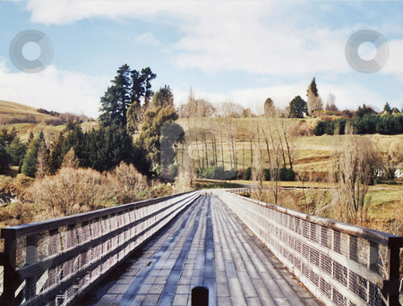 To use this stock image in your creative project, please select the size you need over to the right and click the "Add to Cart" button.
Your downloaded image will come with the Cutcaster watermark removed so don’t worry about the watermark you see on this page. Bridge to Paradise stock photo, The view over the Shot-over river/bridge by Stephen Kerin