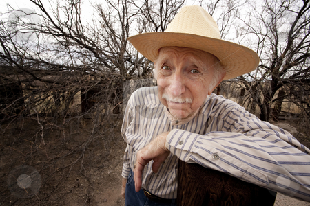 To use this stock image in your creative project, please select the size you need over to the right and click the "Add to Cart" button.
Your downloaded image will come with the Cutcaster watermark removed so don’t worry about the watermark you see on this page. Rancher with sad eyes stock photo, Elderly rancher with sad eyes in a straw hat by Scott Griessel