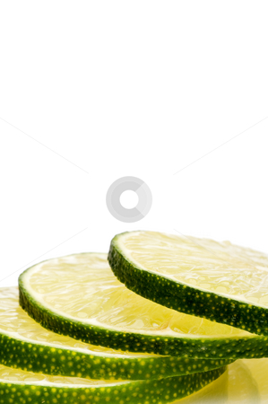 To use this stock image in your creative project, please select the size you need over to the right and click the "Add to Cart" button.
Your downloaded image will come with the Cutcaster watermark removed so don’t worry about the watermark you see on this page. A vertical close-up of a stack of juicy fresh cut lime slices. stock photo, A vertical close-up of a stack of juicy fresh cut lime slices. by Vince Clements