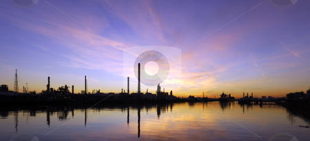 To use this stock image in your creative project, please select the size you need over to the right and click the "Add to Cart" button.
Your downloaded image will come with the Cutcaster watermark removed so don’t worry about the watermark you see on this page. Oil Refinary at sunset stock photo, An oil refinary at sunset, situated in an industrial harbor area, with its piers, jetties and mooring buoys. by Corepics VOF