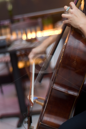 To use this stock image in your creative project, please select the size you need over to the right and click the "Add to Cart" button.
Your downloaded image will come with the Cutcaster watermark removed so don’t worry about the watermark you see on this page. Woman Playing Cello stock photo, A woman sitting down and playing the cello live by Ben Havilland