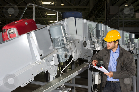 To use this stock image in your creative project, please select the size you need over to the right and click the "Add to Cart" button.
Your downloaded image will come with the Cutcaster watermark removed so don’t worry about the watermark you see on this page. Luggage handling engineer stock photo, A maintenance engineer inspecting a luggage handling conveyor belt by Corepics VOF