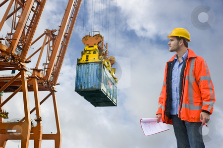 To use this stock image in your creative project, please select the size you need over to the right and click the "Add to Cart" button.
Your downloaded image will come with the Cutcaster watermark removed so don’t worry about the watermark you see on this page. Customs Control inspecting at a commercial harbor stock photo, A Customs Control officer, checking the unloading of freight containers at an industrial harbor, wearing a hard hat and safety coat by Corepics VOF