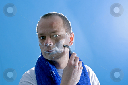 To use this stock image in your creative project, please select the size you need over to the right and click the "Add to Cart" button.
Your downloaded image will come with the Cutcaster watermark removed so don’t worry about the watermark you see on this page. Shaving man stock photo, A middle aged man dressed in a white t-shirt, shaving himself by Corepics VOF