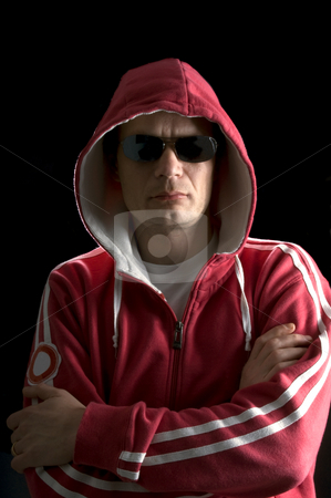 To use this stock image in your creative project, please select the size you need over to the right and click the "Add to Cart" button.
Your downloaded image will come with the Cutcaster watermark removed so don’t worry about the watermark you see on this page. Hoodlum stock photo, A grim looking Hoodlum wearing sunglasses by Corepics VOF