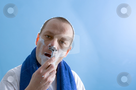 To use this stock image in your creative project, please select the size you need over to the right and click the "Add to Cart" button.
Your downloaded image will come with the Cutcaster watermark removed so don’t worry about the watermark you see on this page. Shaving man stock photo, A middle aged man dressed in a white t-shirt, shaving himself by Corepics VOF