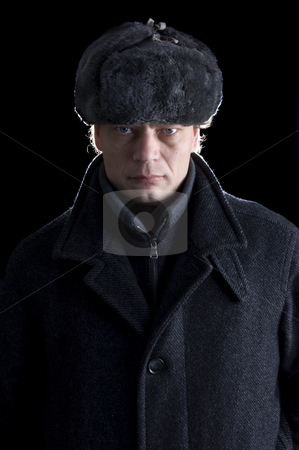To use this stock image in your creative project, please select the size you need over to the right and click the "Add to Cart" button.
Your downloaded image will come with the Cutcaster watermark removed so don’t worry about the watermark you see on this page. Man in winterclothes stock photo, A stern looking man with a fur cap and a woolen coat looking straight into the camera by Corepics VOF