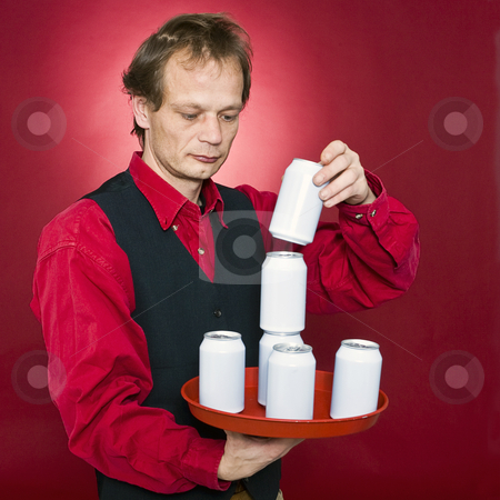To use this stock image in your creative project, please select the size you need over to the right and click the "Add to Cart" button.
Your downloaded image will come with the Cutcaster watermark removed so don’t worry about the watermark you see on this page. Stacking cans stock photo, A waiter stacking cans on a tray by Corepics VOF