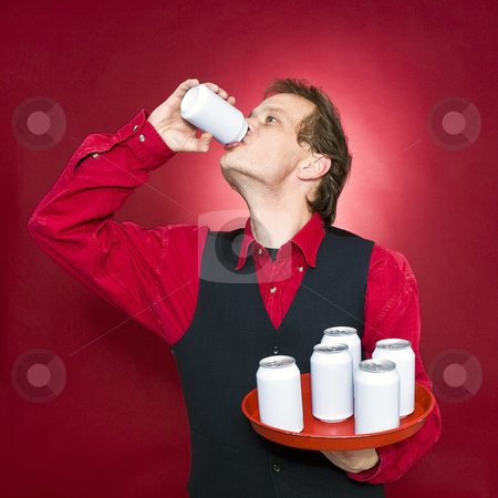 To use this stock image in your creative project, please select the size you need over to the right and click the "Add to Cart" button.
Your downloaded image will come with the Cutcaster watermark removed so don’t worry about the watermark you see on this page. Thirsty waiter stock photo, A waiter, holding a tray with blank cans seeking refreshment and drinking by Corepics VOF