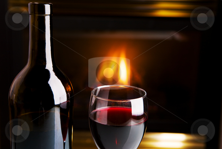 To use this stock image in your creative project, please select the size you need over to the right and click the "Add to Cart" button.
Your downloaded image will come with the Cutcaster watermark removed so don’t worry about the watermark you see on this page. Wine and fire stock photo, A bottle of red wine and glass infront of a fireplace by Steve Mcsweeny