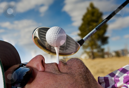 To use this stock image in your creative project, please select the size you need over to the right and click the "Add to Cart" button.
Your downloaded image will come with the Cutcaster watermark removed so don’t worry about the watermark you see on this page. Human Golf Tee stock photo, A golfer holding a tee in his mouth by Steve Mcsweeny