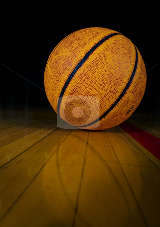 To use this stock image in your creative project, please select the size you need over to the right and click the "Add to Cart" button.
Your downloaded image will come with the Cutcaster watermark removed so don’t worry about the watermark you see on this page. Basketball stock photo, A basketball on a dark gym floor with reflection by Steve Mcsweeny