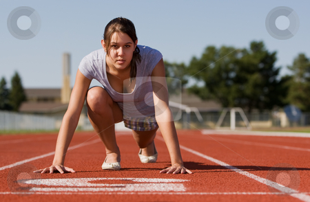To use this stock image in your creative project, please select the size you need over to the right and click the "Add to Cart" button.
Your downloaded image will come with the Cutcaster watermark removed so don’t worry about the watermark you see on this page. Female fitness stock photo, A pretty young woman exercising at a race track by Steve Mcsweeny