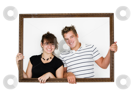 To use this stock image in your creative project, please select the size you need over to the right and click the "Add to Cart" button.
Your downloaded image will come with the Cutcaster watermark removed so don’t worry about the watermark you see on this page. Framed couple stock photo, Young smiling couple in a picture frame by Steve Mcsweeny