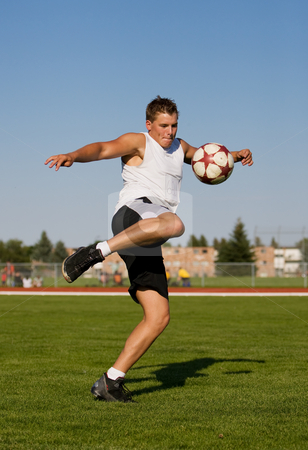 To use this stock image in your creative project, please select the size you need over to the right and click the "Add to Cart" button.
Your downloaded image will come with the Cutcaster watermark removed so don’t worry about the watermark you see on this page. Kicking a soccer ball stock photo, Athletic male kicking a soccer ball outside by Steve Mcsweeny