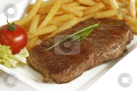 To use this stock image in your creative project, please select the size you need over to the right and click the "Add to Cart" button.
Your downloaded image will come with the Cutcaster watermark removed so don’t worry about the watermark you see on this page. Beef steak stock photo, Grilled beef steak with french fries and sauce served in plate. by Birgit Reitz-Hofmann