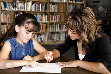 To use this stock image in your creative project, please select the size you need over to the right and click the "Add to Cart" button.
Your downloaded image will come with the Cutcaster watermark removed so don’t worry about the watermark you see on this page. Learning stock photo, A little girl learning from her teacher. by Brenda Carson
