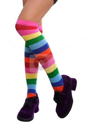 To use this stock image in your creative project, please select the size you need over to the right and click the "Add to Cart" button.
Your downloaded image will come with the Cutcaster watermark removed so don’t worry about the watermark you see on this page. Crazy Legs stock photo, Pretty legs in a crazy combination of multi-colored striped knee-his by Brenda Carson
