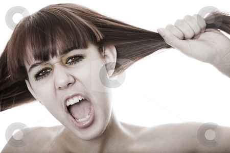 To use this stock image in your creative project, please select the size you need over to the right and click the "Add to Cart" button.
Your downloaded image will come with the Cutcaster watermark removed so don’t worry about the watermark you see on this page. At Wit's End stock photo, A young woman driven to wit's end with frustration. by Brenda Carson