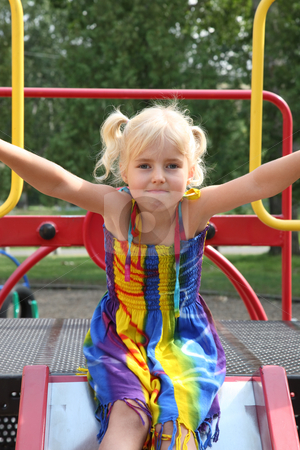 To use this stock image in your creative project, please select the size you need over to the right and click the "Add to Cart" button.
Your downloaded image will come with the Cutcaster watermark removed so don’t worry about the watermark you see on this page. Little Girl on Slide stock photo, Five-year-old girl ready to go down the slide. by Brenda Carson