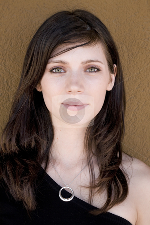 To use this stock image in your creative project, please select the size you need over to the right and click the "Add to Cart" button.
Your downloaded image will come with the Cutcaster watermark removed so don’t worry about the watermark you see on this page. Green-eyed Girl stock photo, Portrait of a beautiful woman with gorgeous green eyes against a neutral earthtone colored wall. by Brenda Carson
