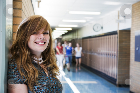 To use this stock image in your creative project, please select the size you need over to the right and click the "Add to Cart" button.
Your downloaded image will come with the Cutcaster watermark removed so don’t worry about the watermark you see on this page. Happy School Girl stock photo, A happy high school student with other students running in the school hallway. by Brenda Carson
