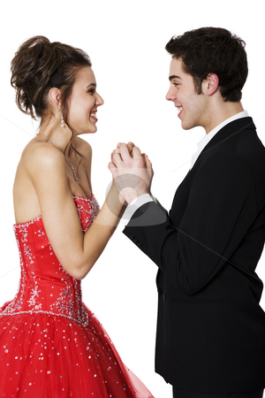 To use this stock image in your creative project, please select the size you need over to the right and click the "Add to Cart" button.
Your downloaded image will come with the Cutcaster watermark removed so don’t worry about the watermark you see on this page. Young Love stock photo, First love. Boy & girl, in formal attire, holding hands & smiling at each other. by Brenda Carson